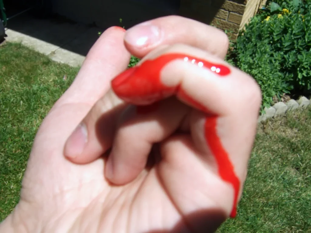 Fake blood finger test.