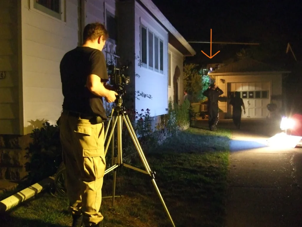 Behind the scenes. Otto stands above the fight scene.