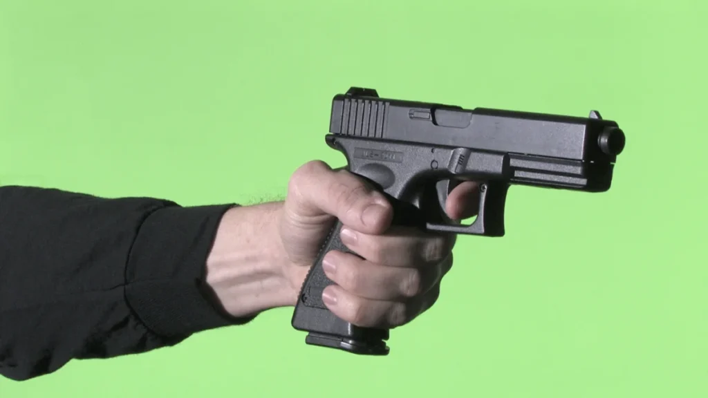 Airsoft gun from the front using a Chroma Key wall.